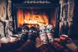christmas socks and hot chocolate in front of fire