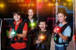 kids holding laser tag guns