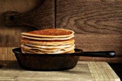 stack of pancakes in cast iron skillet