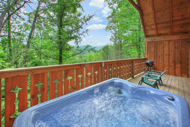 Hot tub on the deck of a romantic 1 bedroom cabin rental in Gatlinburg.